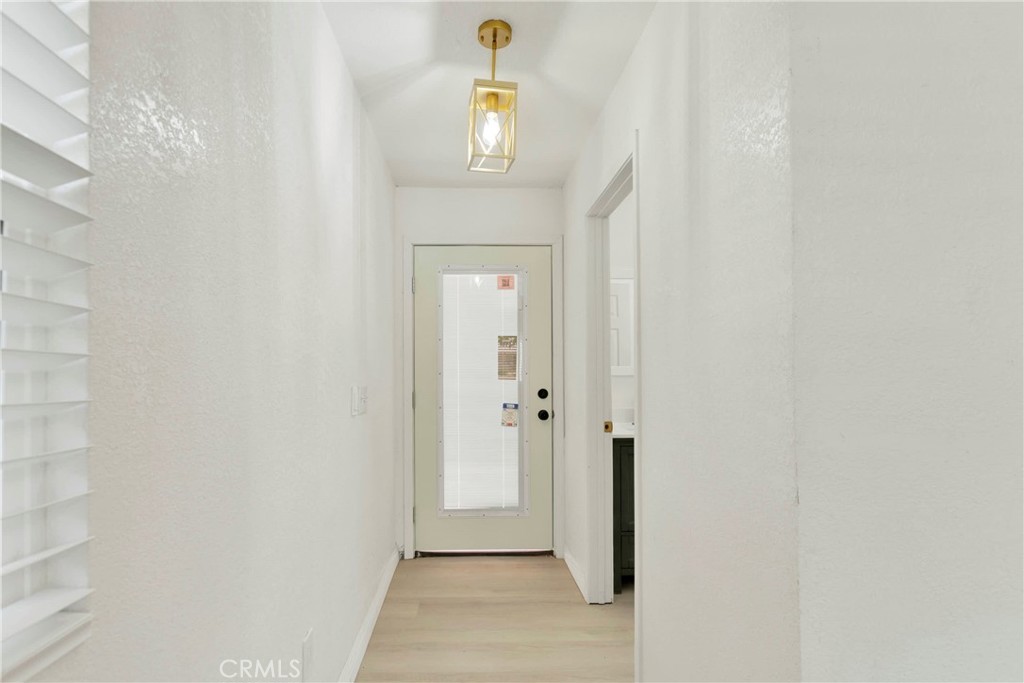 8263 3rd Avenue Hesperia, CA 92345 - Photo 33 of 56 a view of a hallway view with wooden floor and staircase