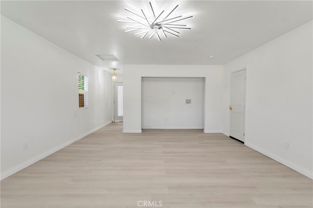 8263 3rd Avenue Hesperia, CA 92345 - Photo 35 of 56 a view of a livingroom with a chandelier fan