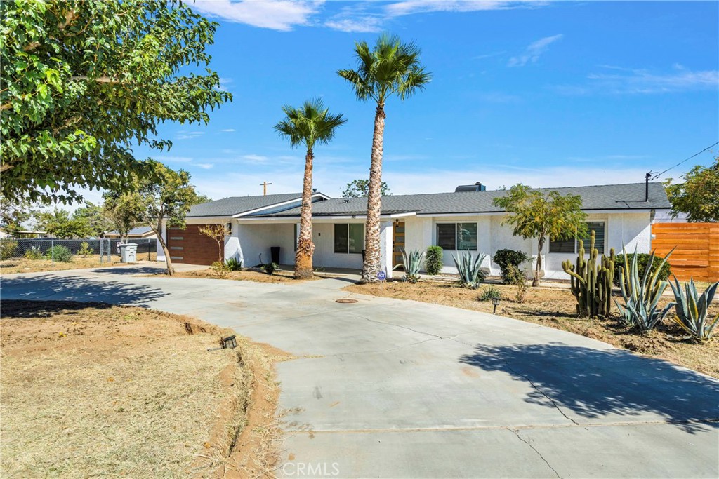 8263 3rd Avenue Hesperia, CA 92345 - Photo 4 of 56 a view of a house with backyard and sitting area