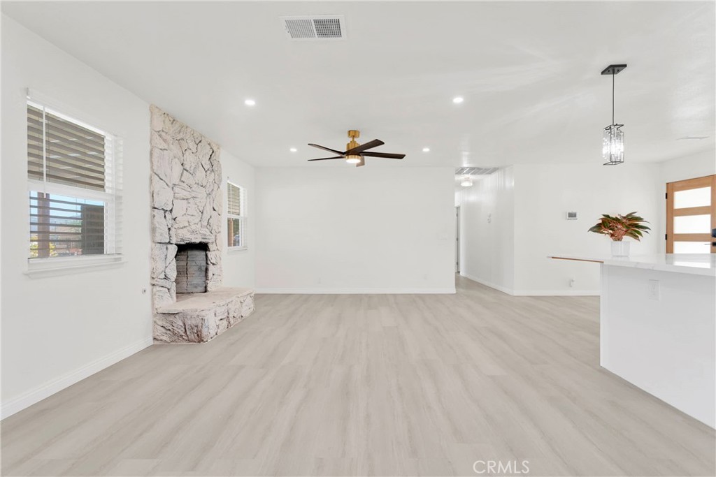 8263 3rd Avenue Hesperia, CA 92345 - Photo 10 of 56 a view of livingroom with hardwood floor and a ceiling fan