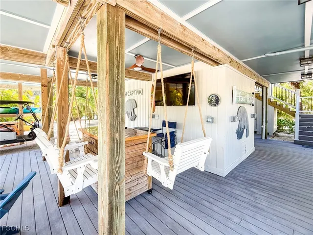 a view of a room with wooden floor and a window