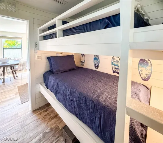 a front view of a house with wooden floor and windows