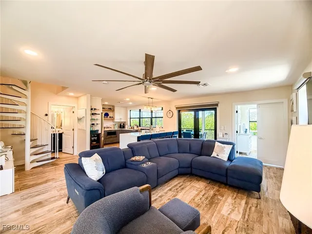 a view of a kitchen filled with furniture and a window