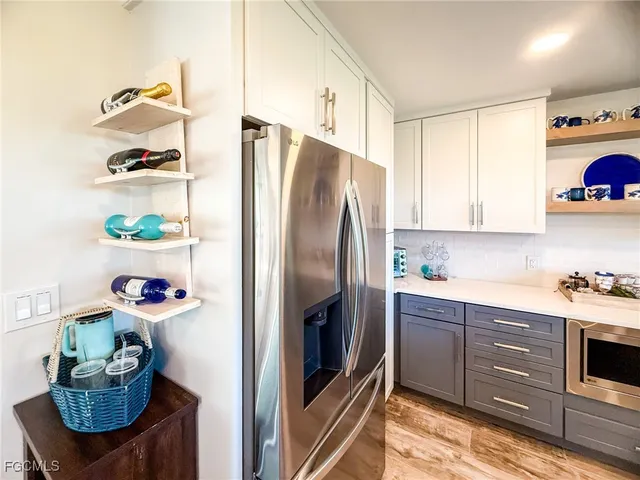a kitchen with a sink cabinets and window