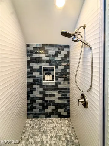 a bathroom with a sink a vanity and a mirror