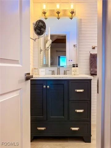 a balcony with furniture and a potted plant
