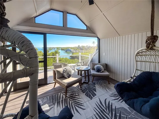 a view of a balcony with wooden floor