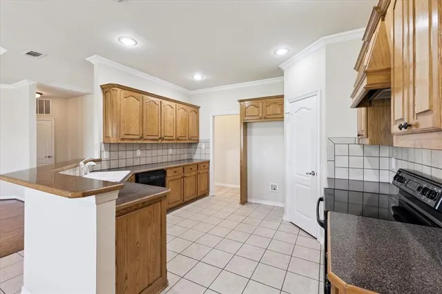 a kitchen with stainless steel appliances granite countertop a sink and cabinets