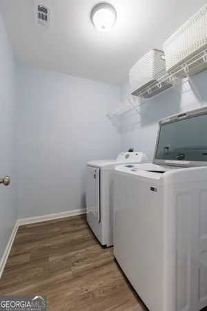 a bedroom with a bed and a ceiling fan