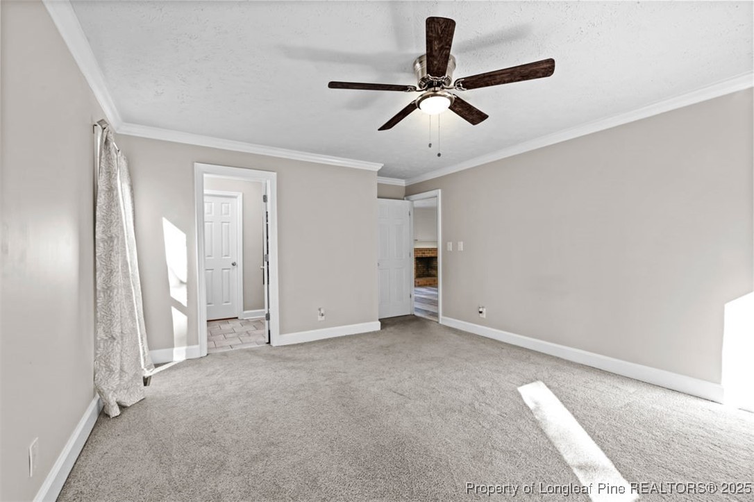 6922 South Staff Road Fayetteville, NC 28306 - Photo 16 of 45 a view of a livingroom with a ceiling fan & entryway