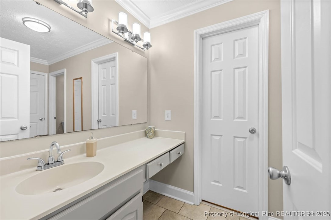 6922 South Staff Road Fayetteville, NC 28306 - Photo 17 of 45 a bathroom with a sink double vanity and a mirror