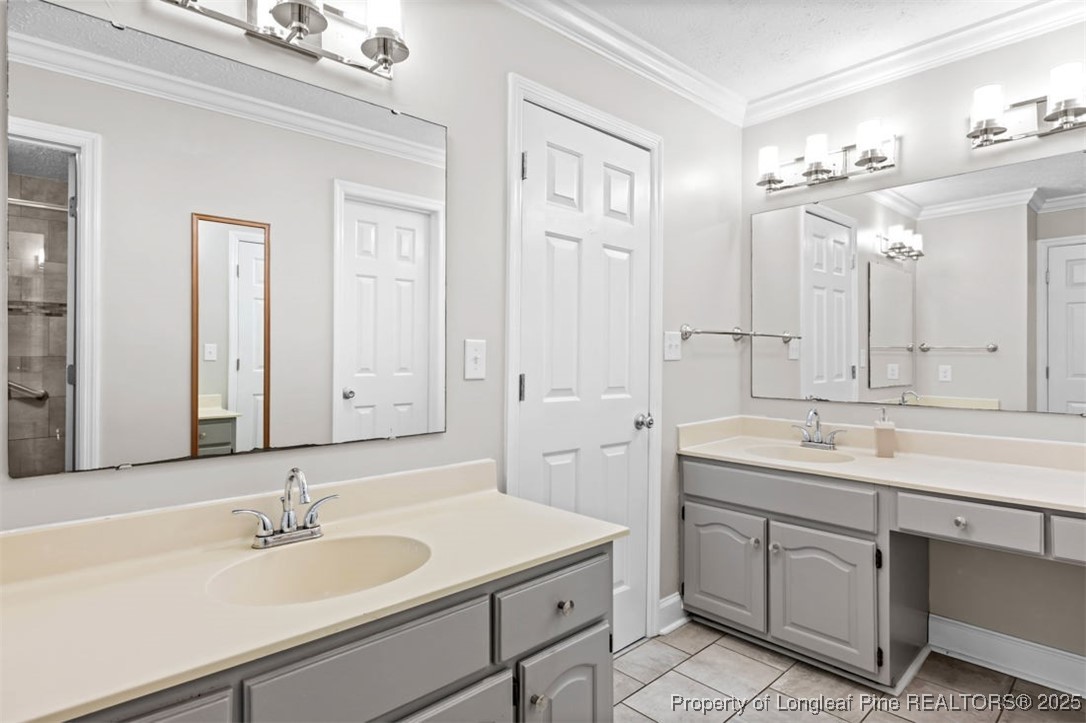 6922 South Staff Road Fayetteville, NC 28306 - Photo 18 of 45 a bathroom with a sink and a mirror