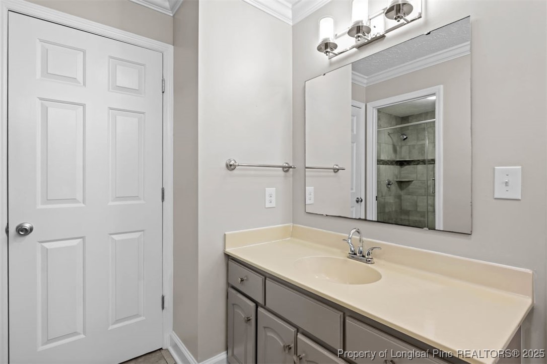 6922 South Staff Road Fayetteville, NC 28306 - Photo 19 of 45 a bathroom with a sink and a mirror
