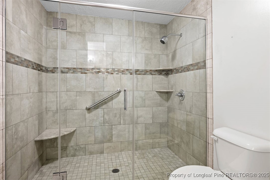6922 South Staff Road Fayetteville, NC 28306 - Photo 22 of 45 a bathroom with a shower and a toilet