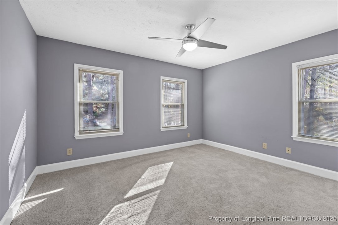 6922 South Staff Road Fayetteville, NC 28306 - Photo 23 of 45 a view of a livingroom with a ceiling fan and window