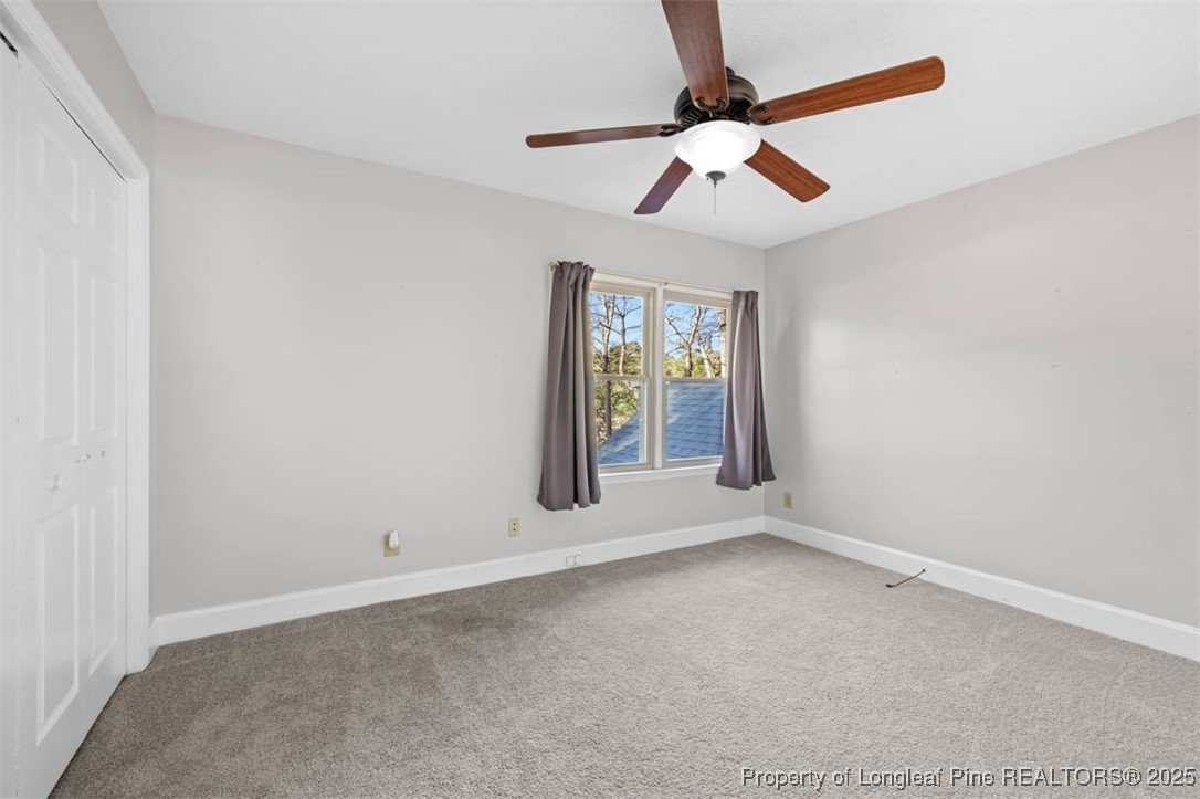 6922 South Staff Road Fayetteville, NC 28306 - Photo 25 of 45 an empty room with windows and fan