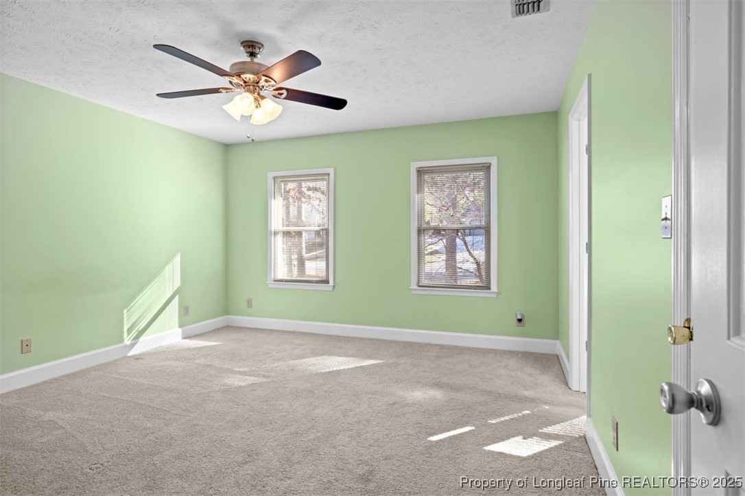 6922 South Staff Road Fayetteville, NC 28306 - Photo 29 of 45 a view of room with window and ceiling fan
