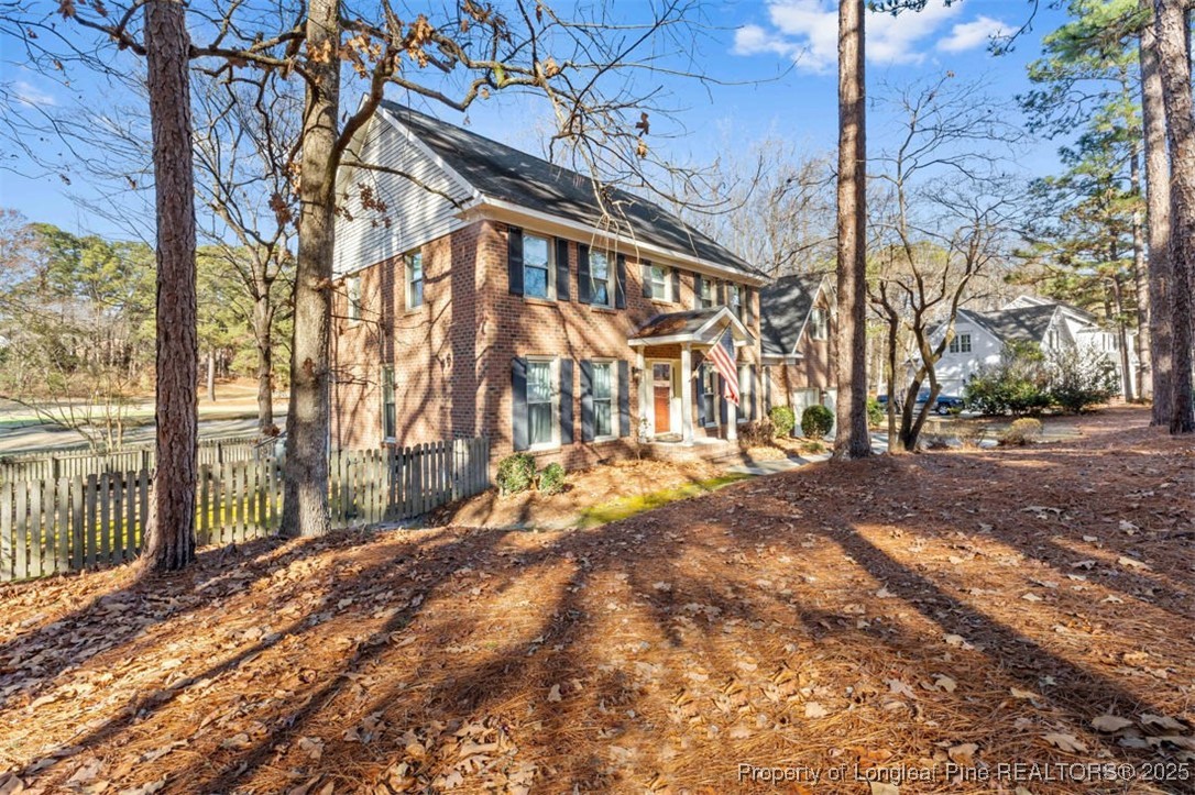 6922 South Staff Road Fayetteville, NC 28306 - Photo 3 of 45 a view of a yard with wooden fence