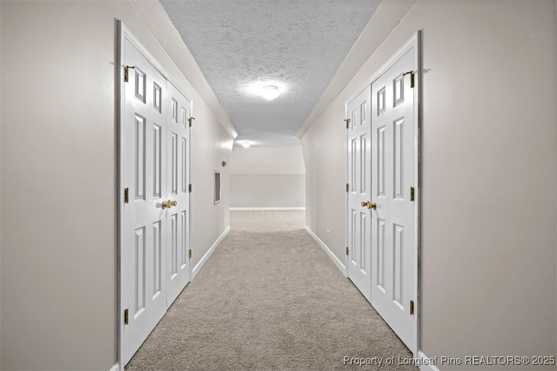 6922 South Staff Road Fayetteville, NC 28306 - Photo 32 of 45 a view of a hallway with wooden floor