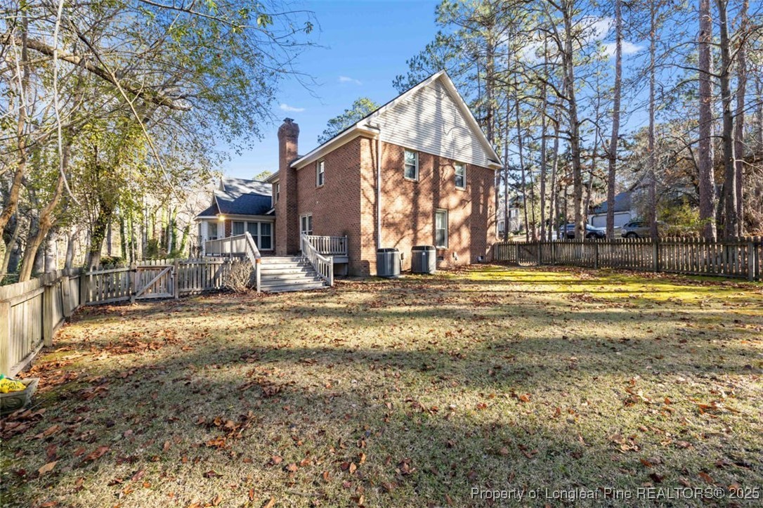 6922 South Staff Road Fayetteville, NC 28306 - Photo 38 of 45 a view of a house with a yard