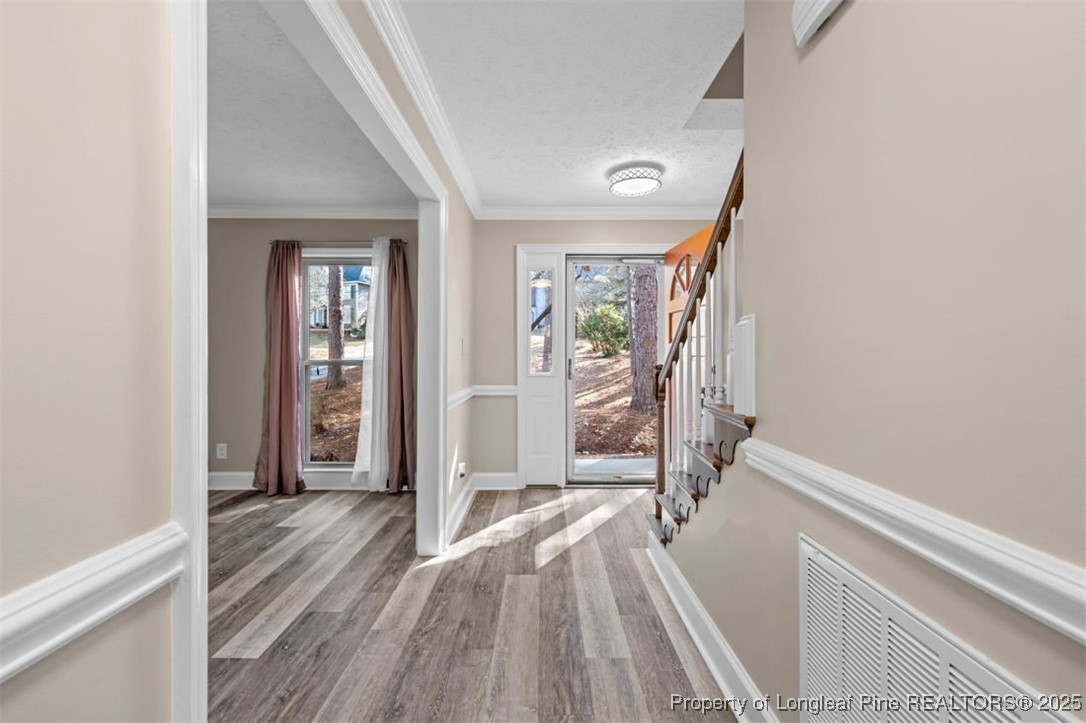 6922 South Staff Road Fayetteville, NC 28306 - Photo 5 of 45 a view of hallway with wooden floor