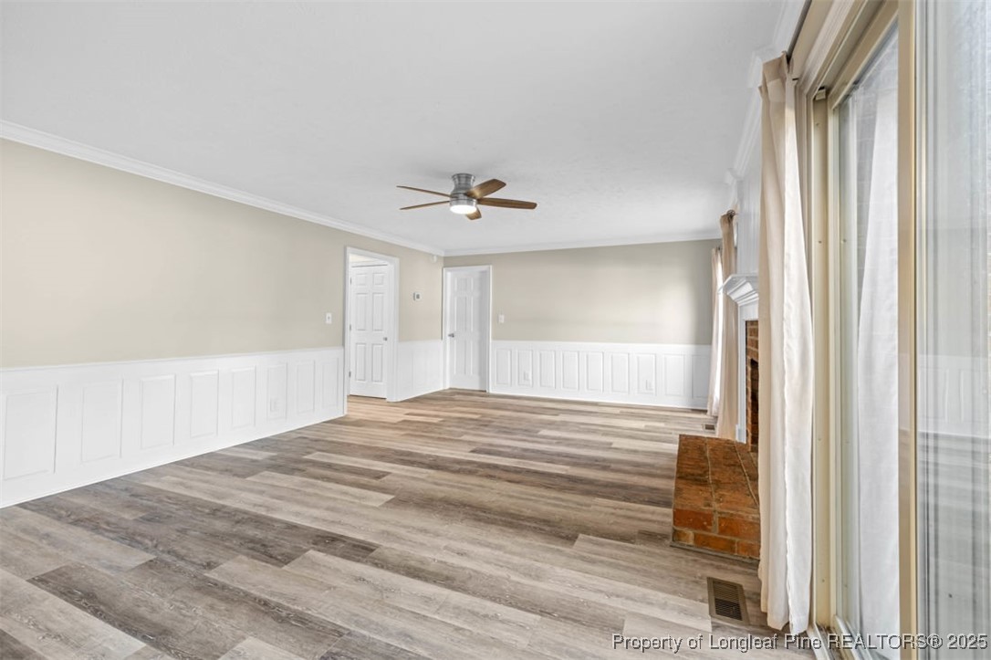 6922 South Staff Road Fayetteville, NC 28306 - Photo 7 of 45 a view of a room with wooden floor and window