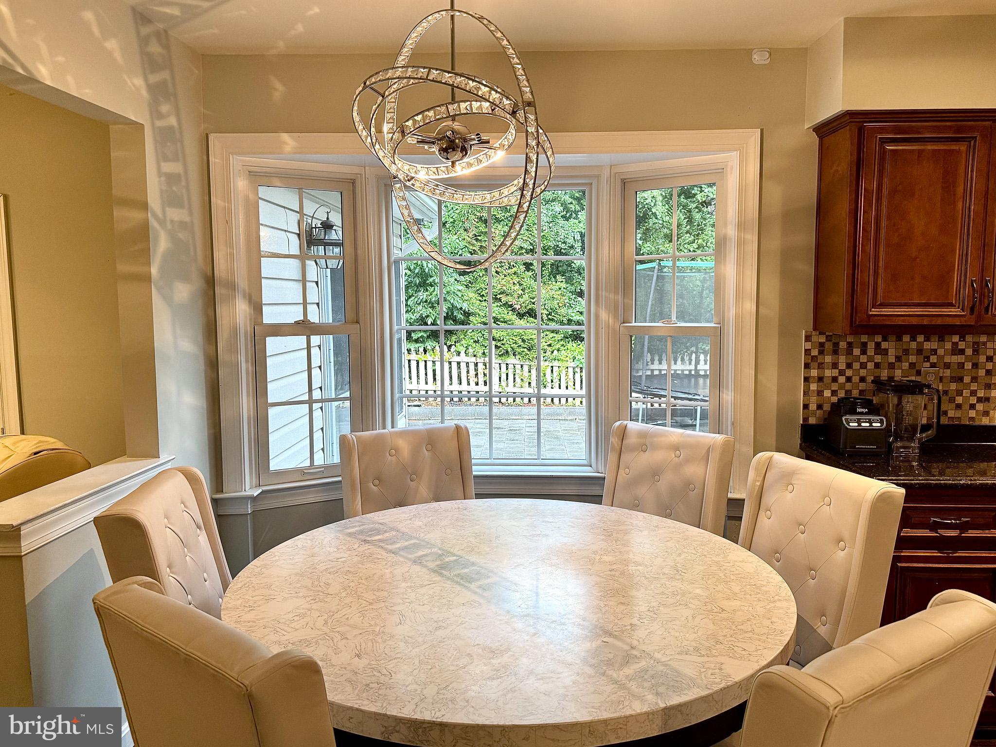 6421 Spring Lake Drive Burke, VA 22015 - Photo 14 of 65 a living room with furniture and a chandelier