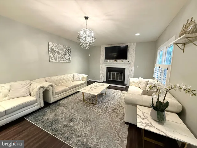 a living room filled with furniture and a table