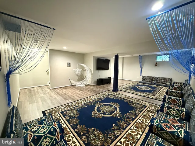 a bedroom with a bed and a book shelf