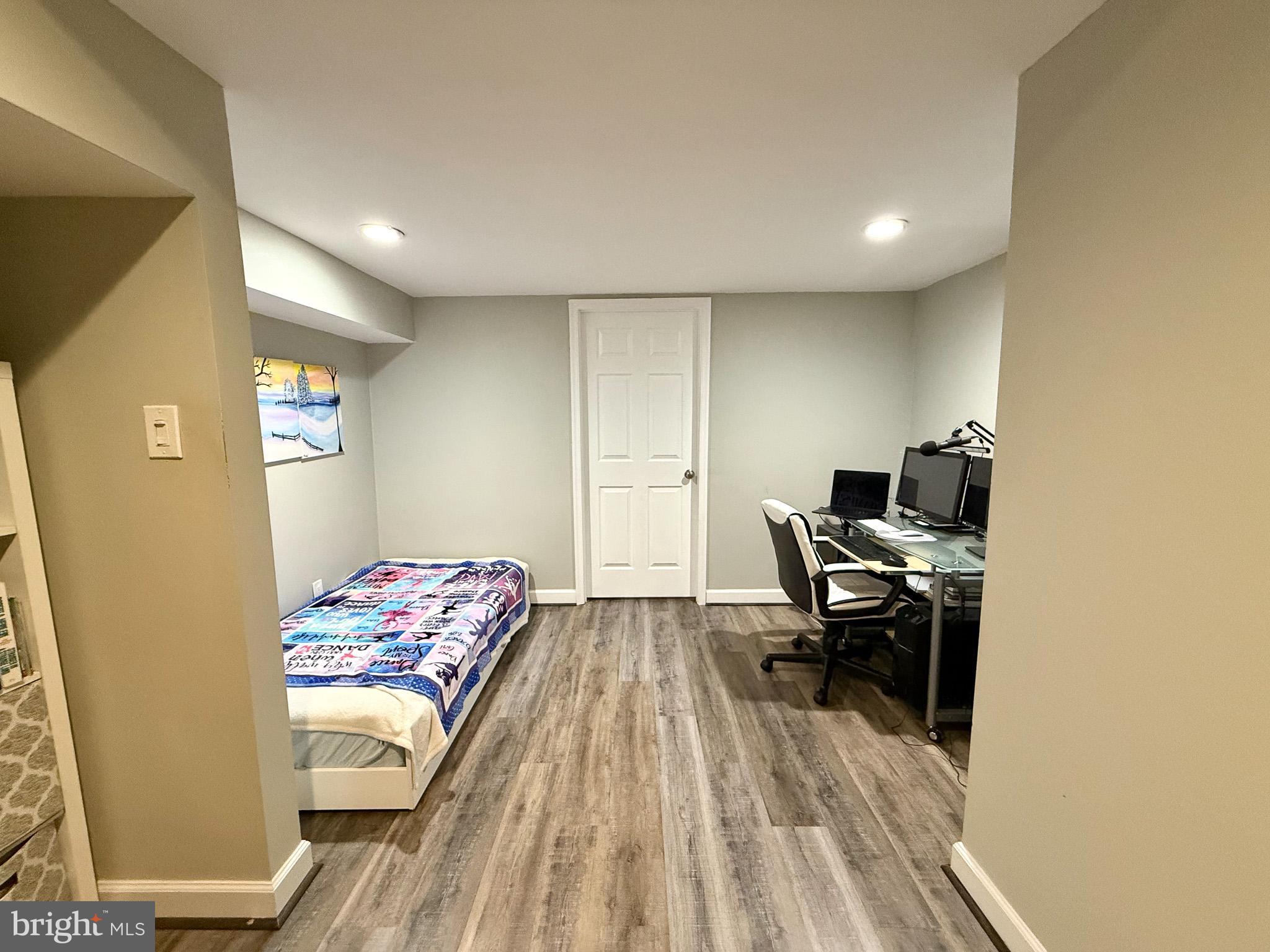 6421 Spring Lake Drive Burke, VA 22015 - Photo 35 of 65 a view of a workspace with furniture and wooden floor