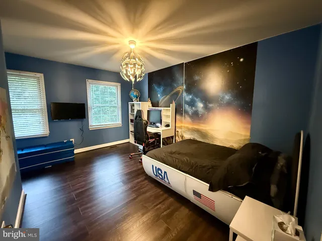 a bathroom with a granite countertop sink a vanity and a mirror