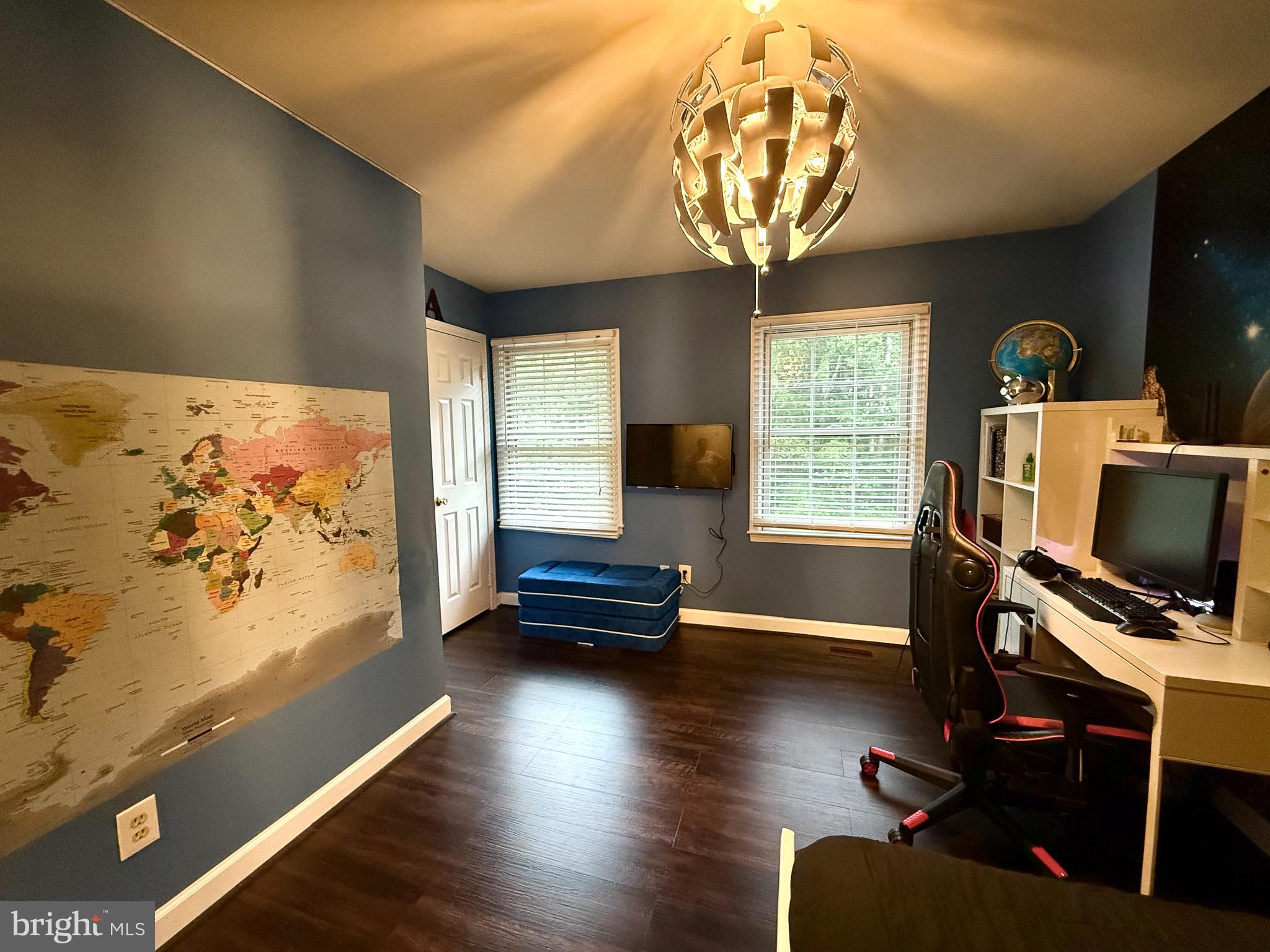 6421 Spring Lake Drive Burke, VA 22015 - Photo 43 of 65 a living room with furniture and a flat screen tv