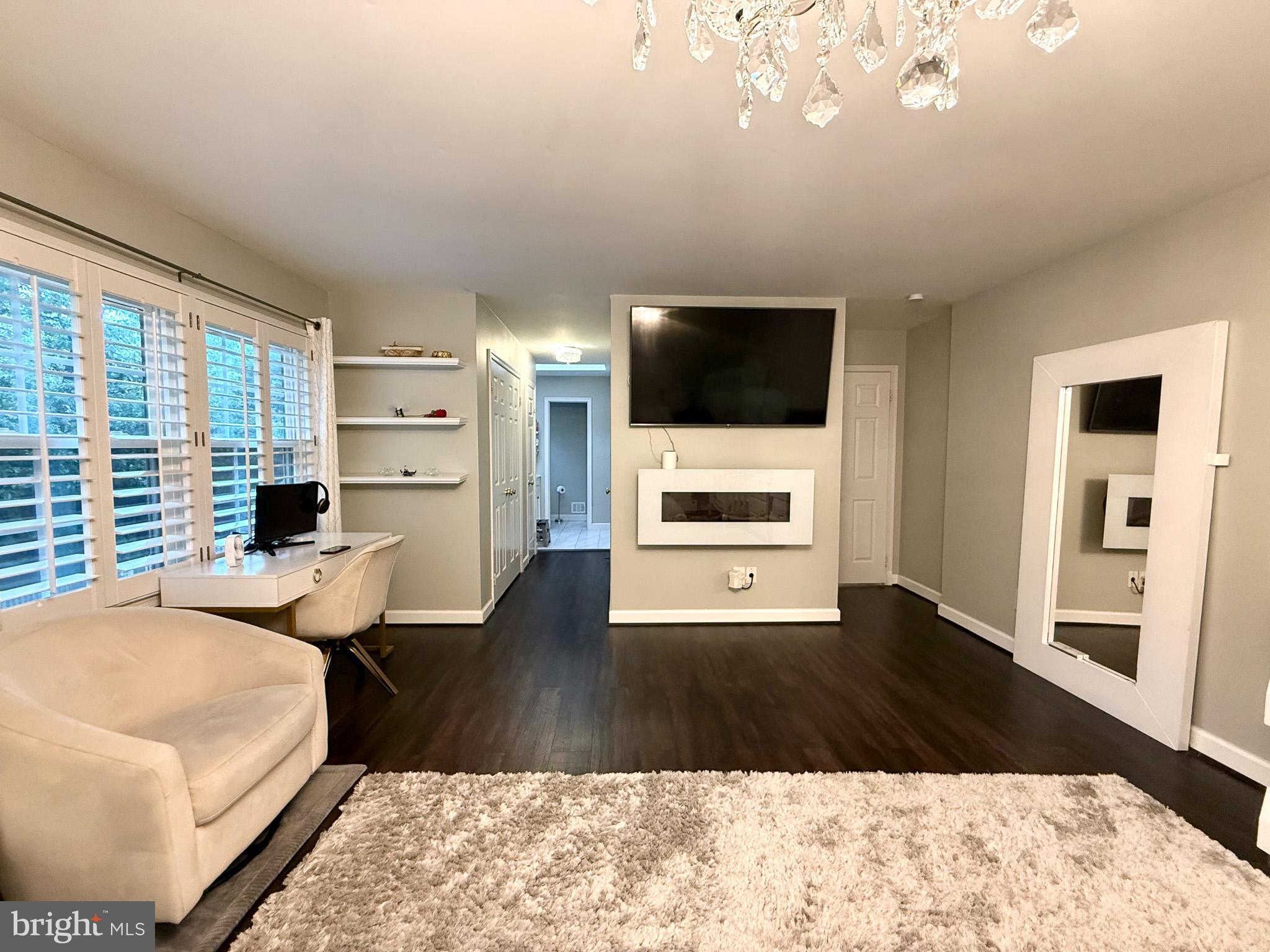 6421 Spring Lake Drive Burke, VA 22015 - Photo 49 of 65 a living room with furniture and a flat screen tv
