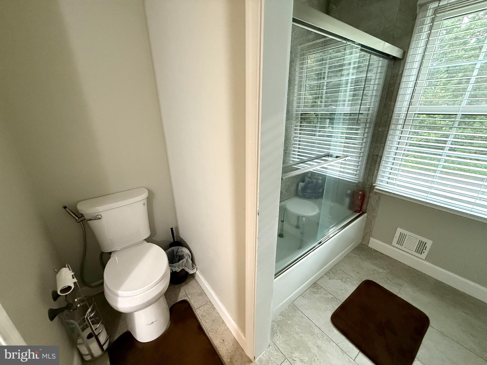 6421 Spring Lake Drive Burke, VA 22015 - Photo 60 of 65 a bathroom with a toilet and a shower
