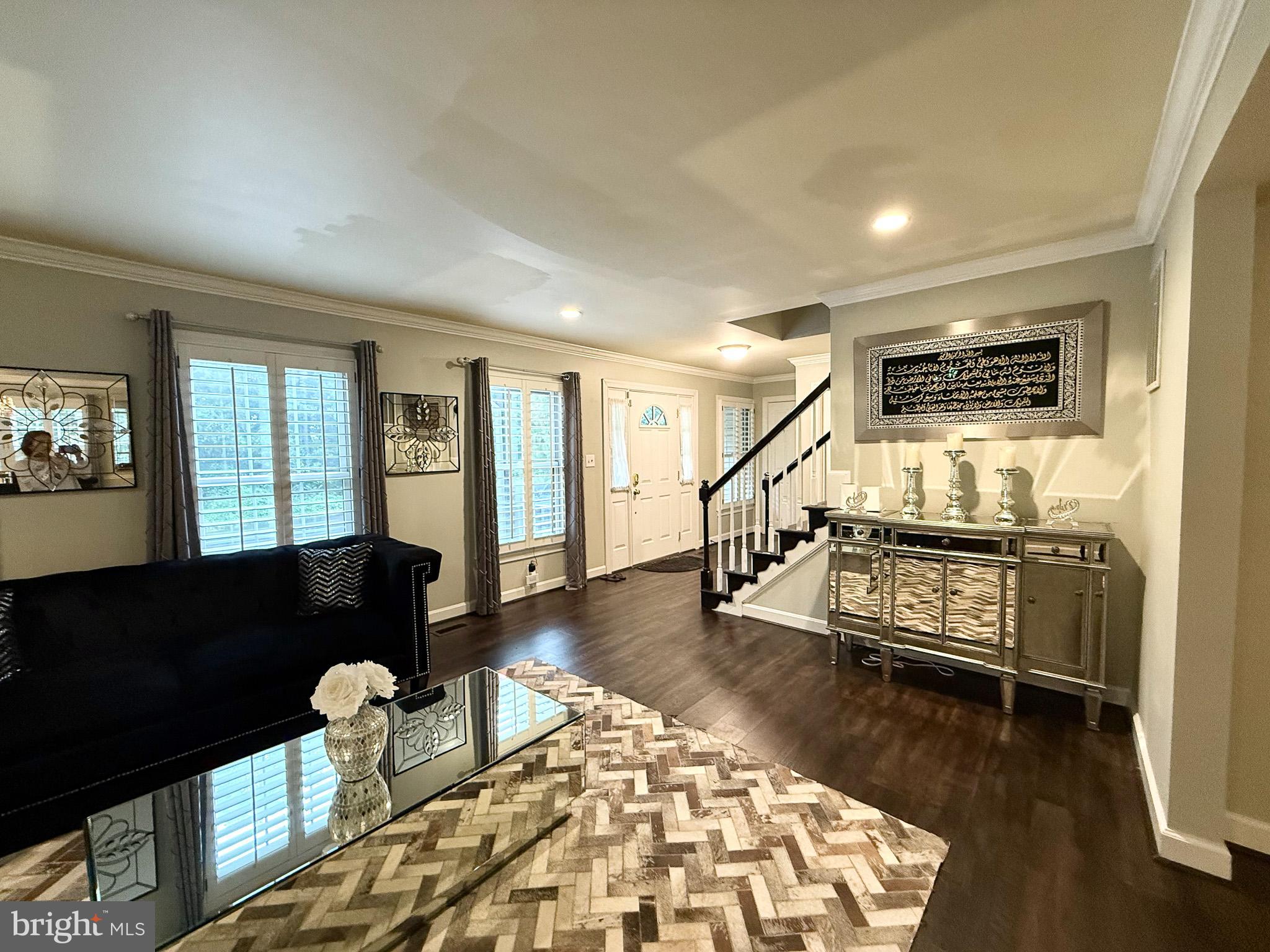 6421 Spring Lake Drive Burke, VA 22015 - Photo 6 of 65 a living room with furniture and a wooden floor