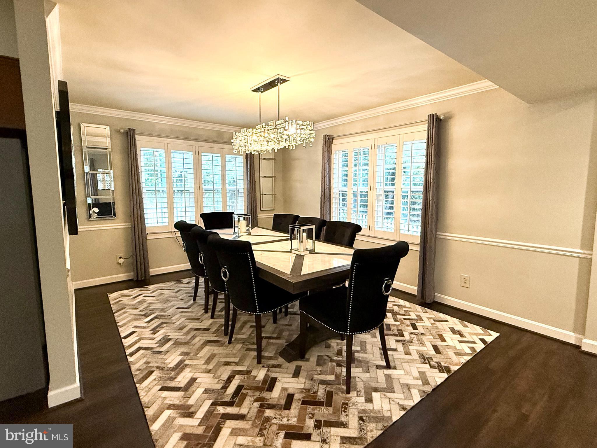 6421 Spring Lake Drive Burke, VA 22015 - Photo 8 of 65 a view of a dining room with furniture window and wooden floor