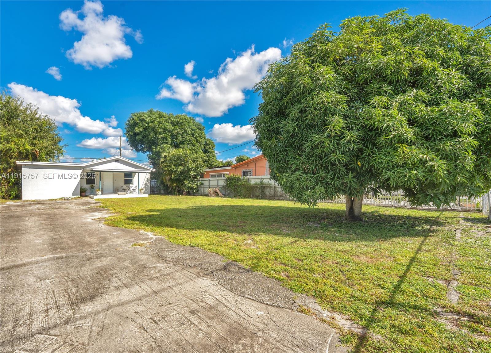 827 Northwest 114th Street Miami, FL 33168 - Photo 20 of 23 a view of a house with a big yard