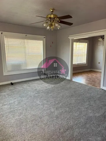 a view of an empty room with a window