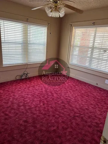 a front view of a house with a large window