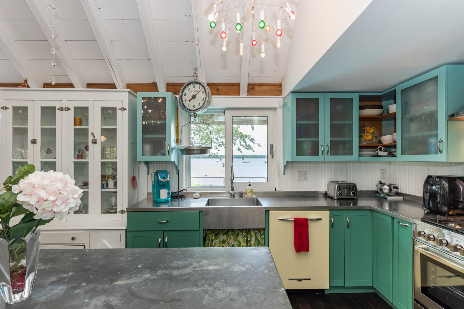 37 Seconsett Point Road Mashpee, MA 02649 - Photo 10 of 28 a kitchen with cabinets and window