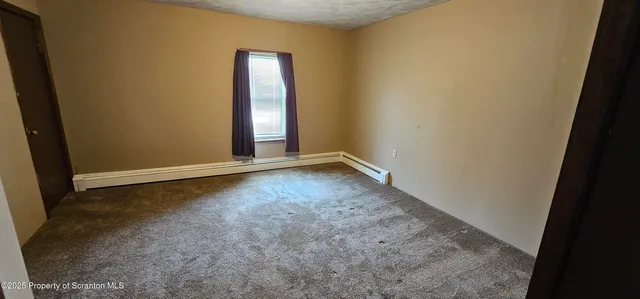 a view of an empty room with window