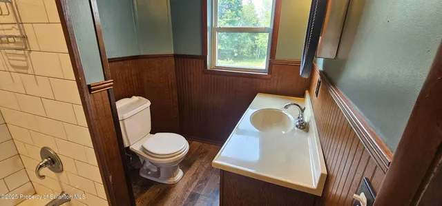 a bathroom with a toilet and a sink