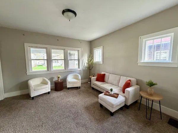 a living room with furniture and windows