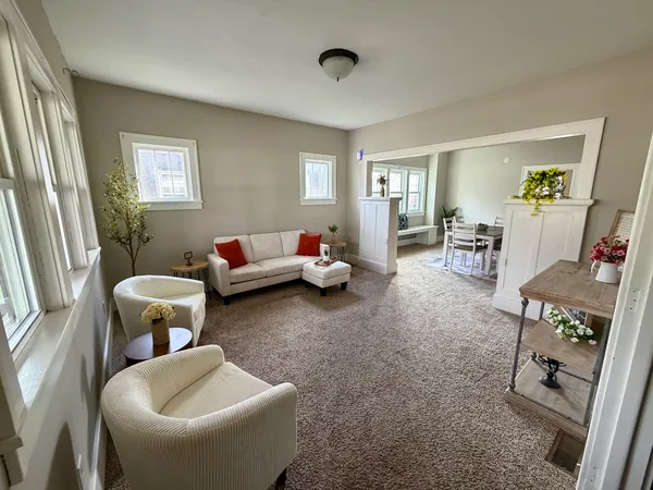 a living room with furniture and a window