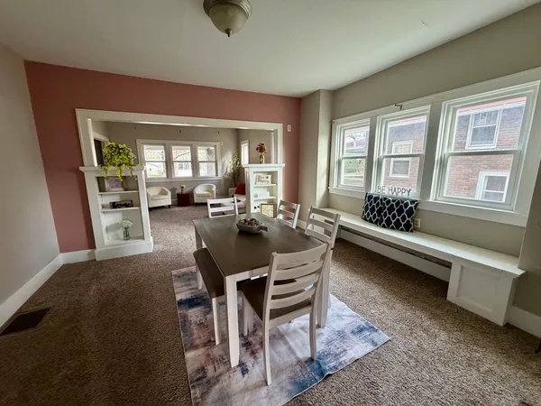 a view of a dining room with furniture window and outside view