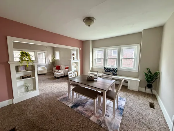 a living room with furniture and a table
