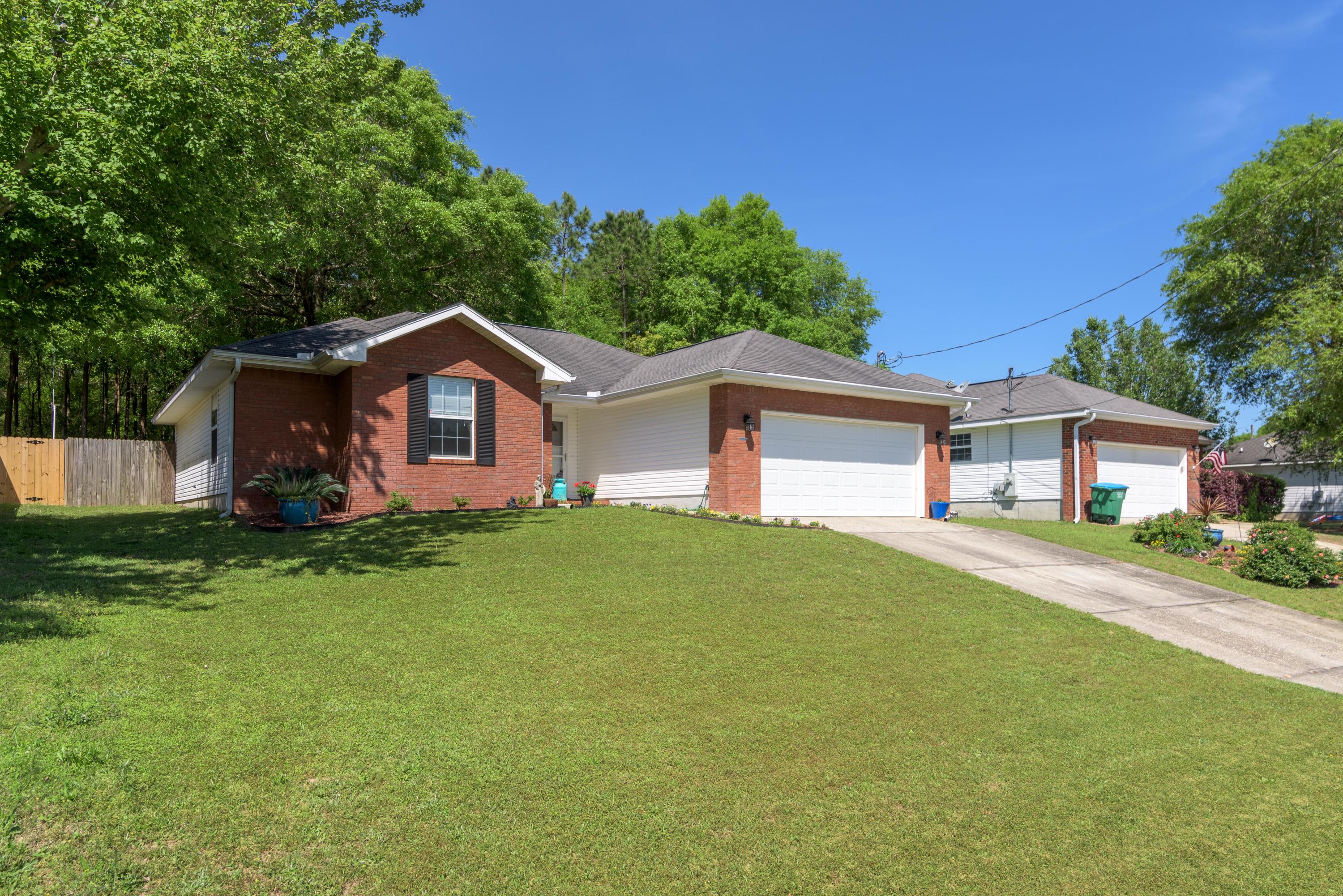 205 Tiffot Court Crestview, FL 32539 - Photo 2 of 32 front view of a house with a yard