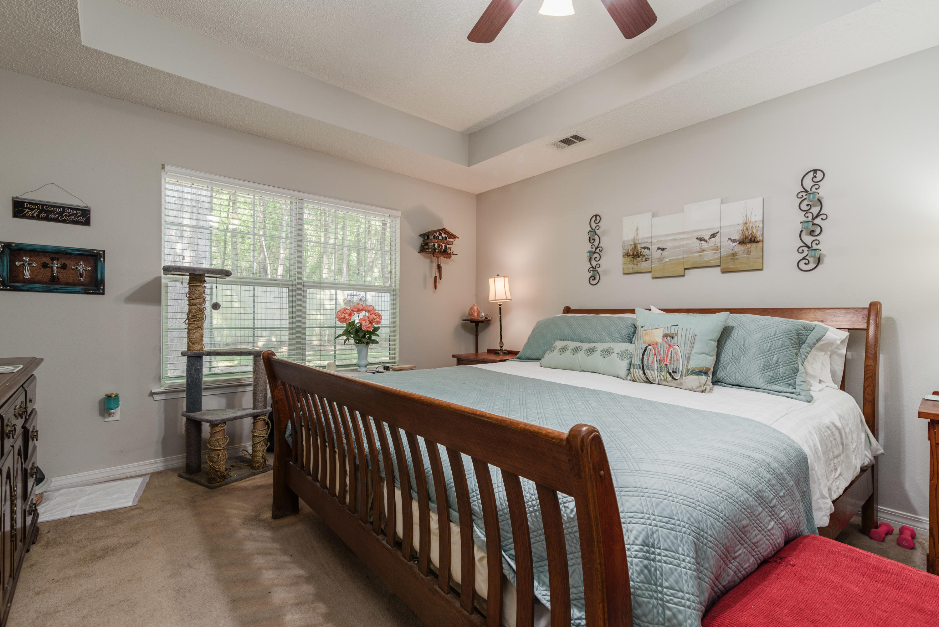 205 Tiffot Court Crestview, FL 32539 - Photo 16 of 32 a bedroom with a bed and a large window