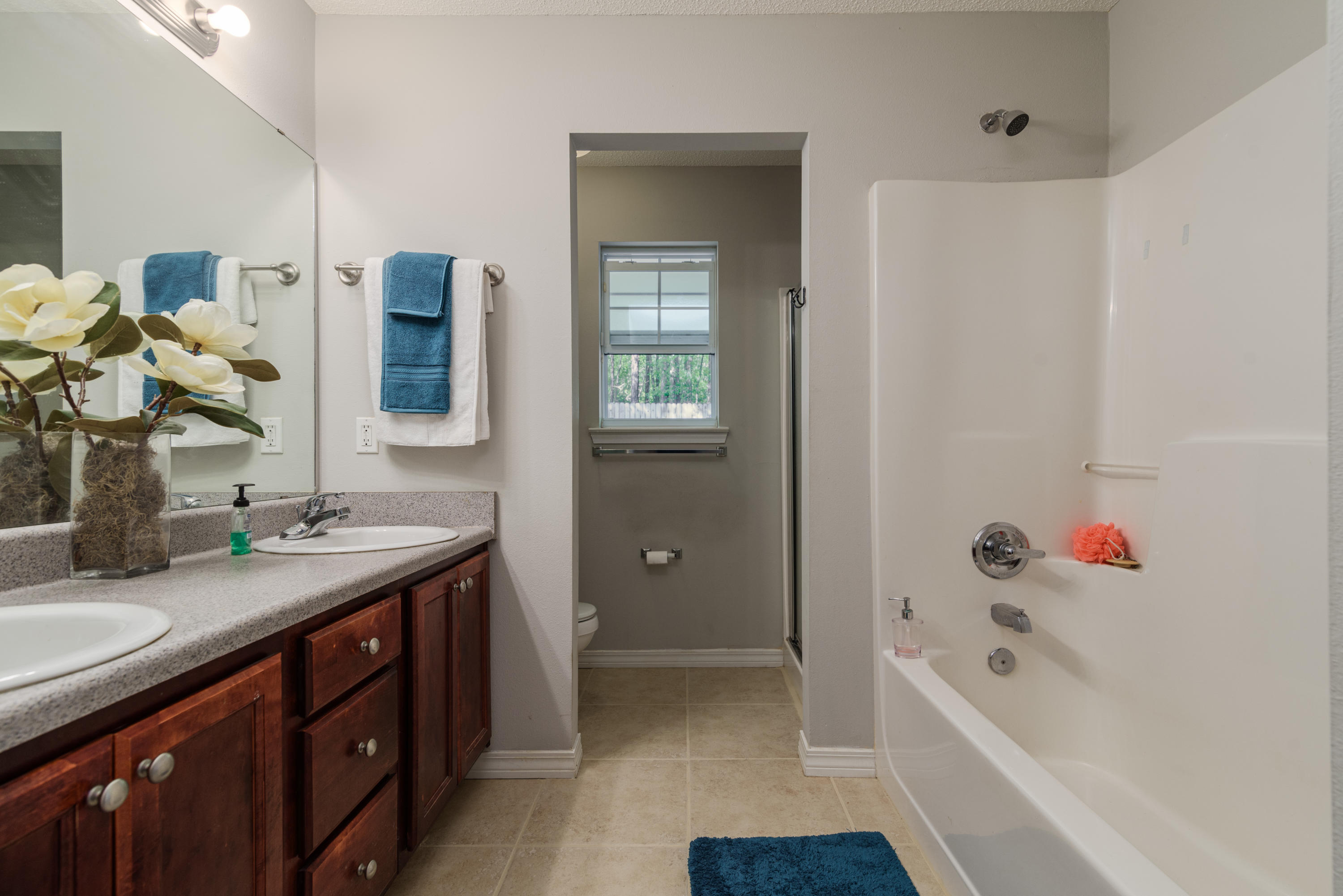 205 Tiffot Court Crestview, FL 32539 - Photo 18 of 32 a bathroom with a tub sink and mirror