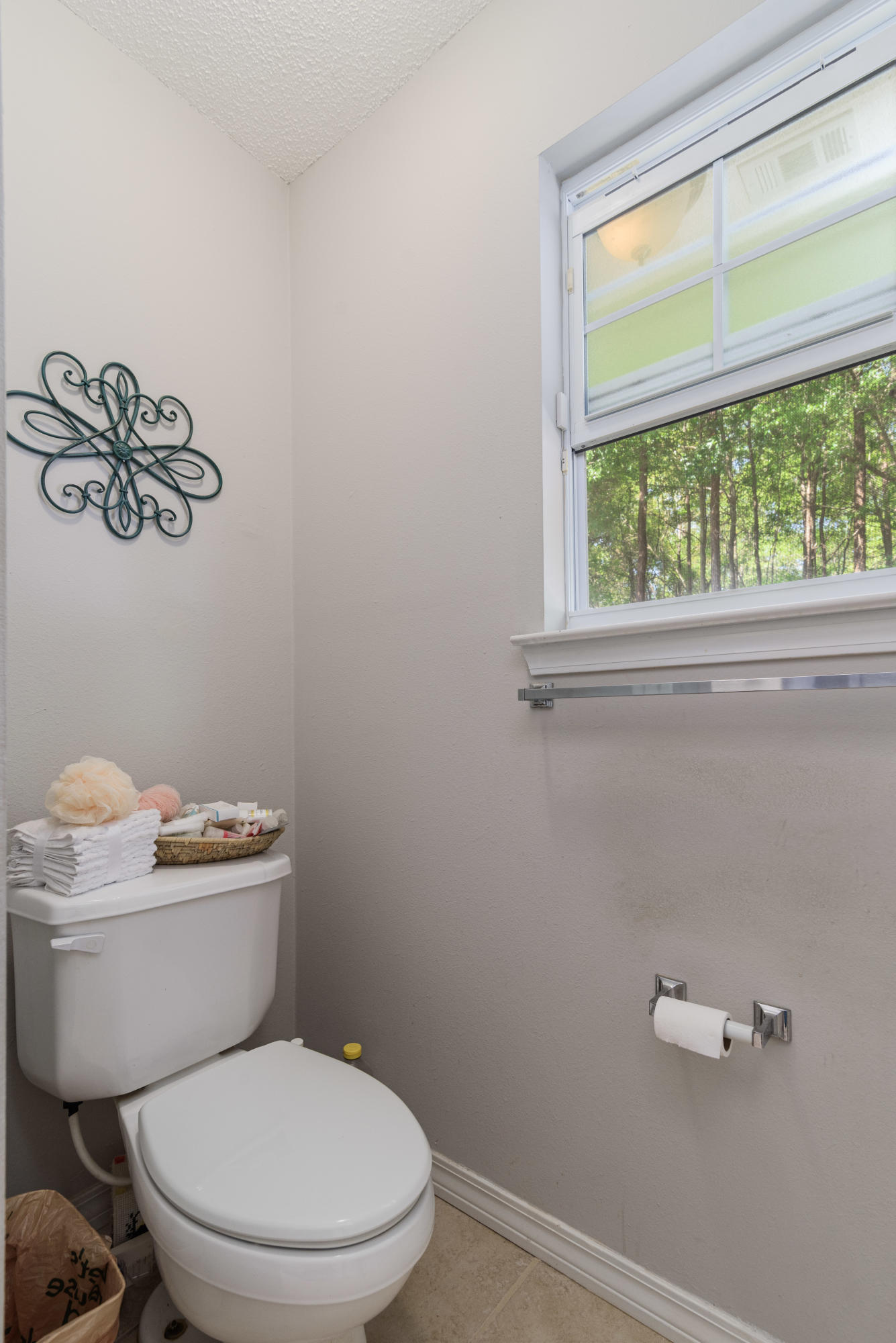 205 Tiffot Court Crestview, FL 32539 - Photo 21 of 32 a white toilet sitting next to a window